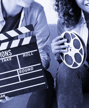 Young women with movie film reel